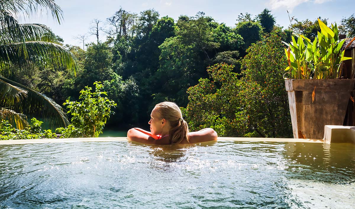 woman relaxing in swimming pool