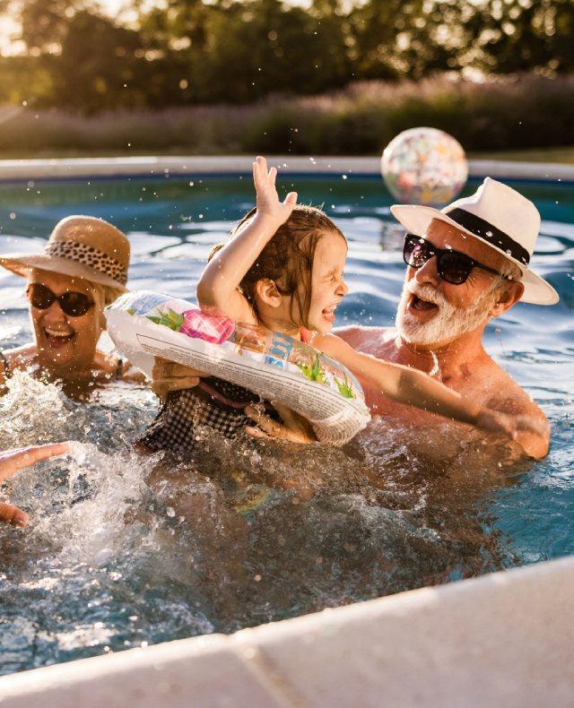 family having fun in the pool