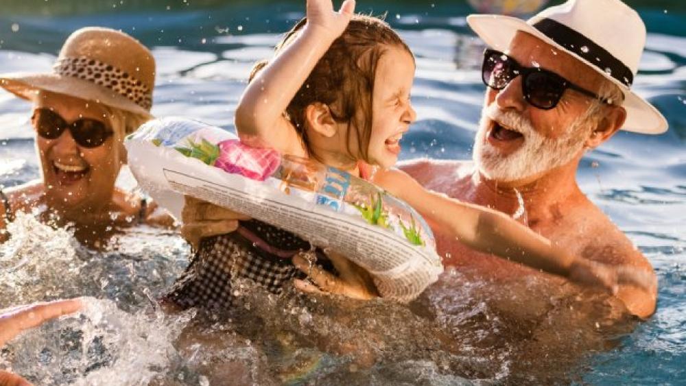 family having fun in the pool